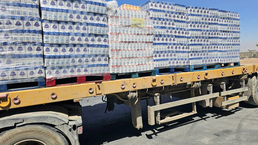 FILE PHOTO: A truck loaded with aid is seen at the Kerem Shalom crossing between Israel and Gaza, on its Israeli side in this handout image obtained by Reuters on May 20, 2025. COGAT/Handout via REUTERS/File Photo
