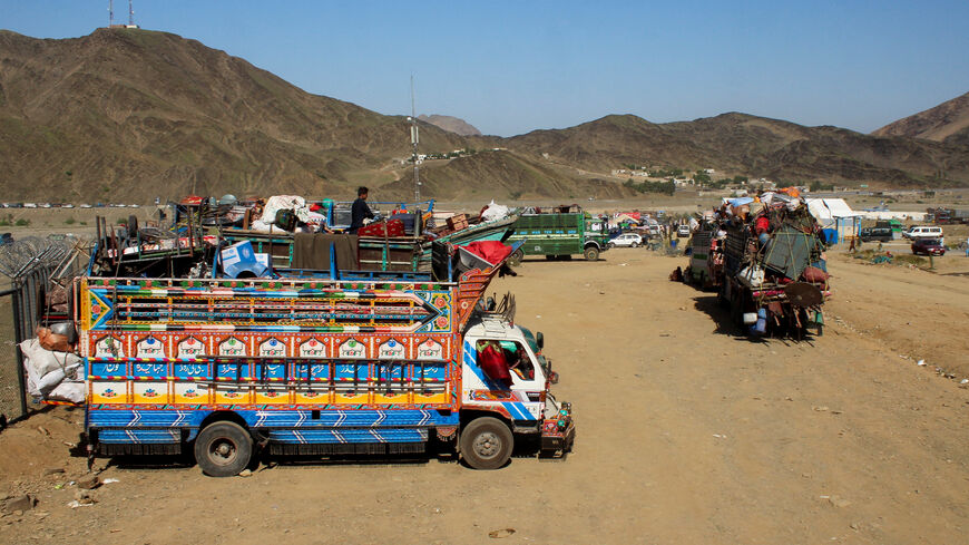 Trucks transporting Afghan nationals, who were expelled from Pakistan, are parked as refugees wait for registration at the Omari refugee camp in Mohmand Dara, Torkham border, Nangarhar province, Afghanistan, April 15, 2025. REUTERS/Hedyatshah Hedayat/File Photo