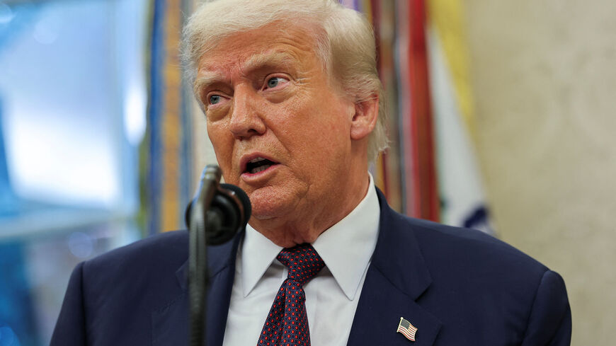 U.S. President Donald Trump speaks, as he and Apple CEO Tim Cook (not pictured) present Apple's announcement of a $100 billion investment in U.S. manufacturing, in the Oval Office at the White House in Washington, D.C., U.S., August 6, 2025. REUTERS/Jonathan Ernst