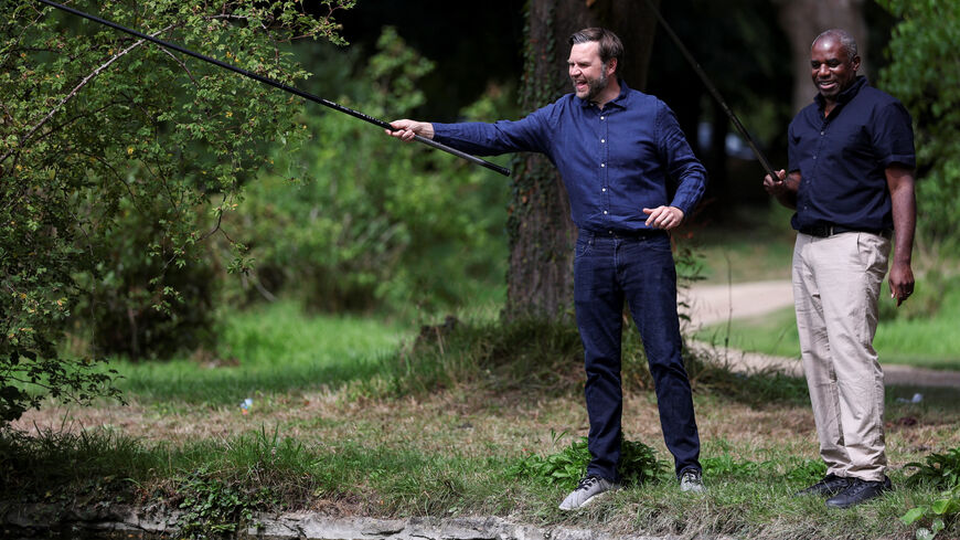 U.S. Vice President JD Vance fishes with British Foreign Secretary David Lammy at Chevening House in Sevenoaks, Britain, August 8, 2025. REUTERS/Suzanne Plunkett/Pool