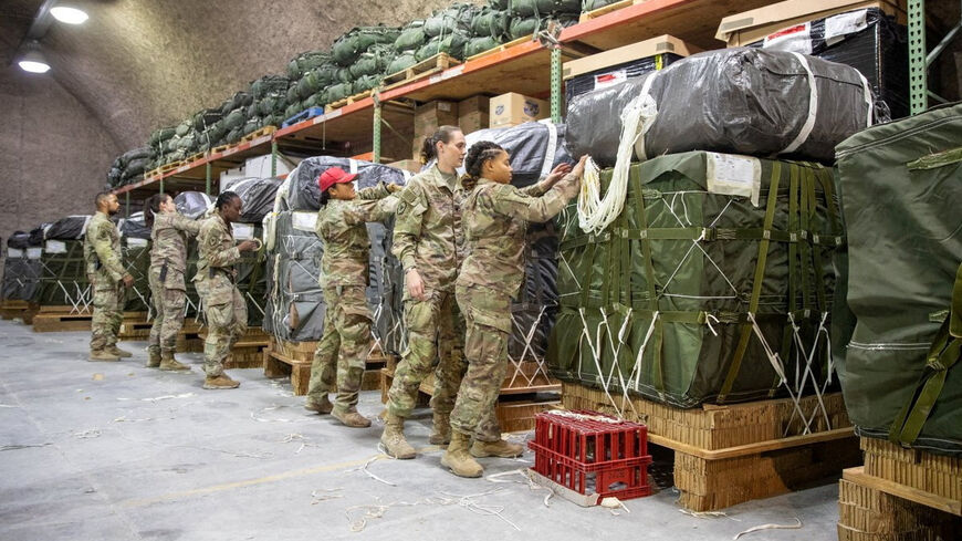 FILE PHOTO: U.S. Air Force members work on the preparation of a humanitarian aid drop for Gaza residents, in this picture released on March 5, 2024. US Central Command via X/Handout via REUTERS/File Photo
