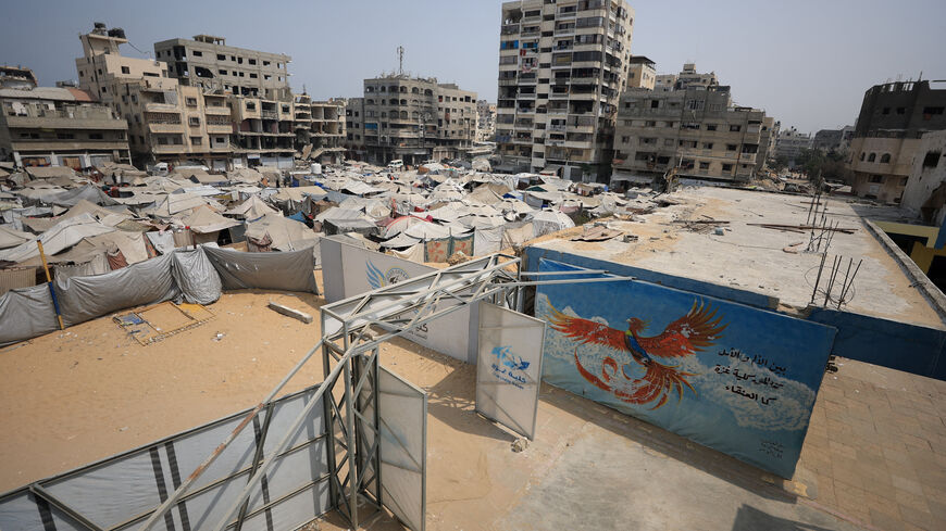 Palestinians, displaced by the Israeli offensive, shelter in tents as seen from Gaza College, where instructors from Edward Said National Conservatory of Music train Palestinians on music, in Gaza City, August 12, 2025. REUTERS/Dawoud Abu Alkas