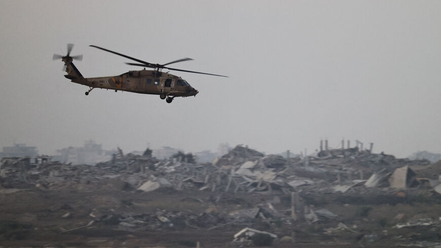 An Israeli Blackhawk evacuation helicopter flies over Gaza, as seen from the Israeli side of the border, Israel August 18, 2025. REUTERS/Amir Cohen
