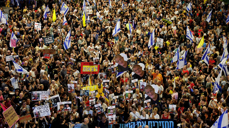 FILE PHOTO: Demonstrators attend a protest demanding the immediate release of the hostages kidnapped during the deadly October 7, 2023 attack on Israel by Hamas, and the end of the war, in Tel Aviv, Israel, August 9, 2025. REUTERS/Amir Cohen/File Photo