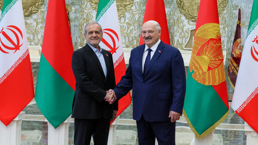 Belarusian President Alexander Lukashenko and Iranian President Masoud Pezeshkian shake hands during a meeting in Minsk, Belarus, August 20, 2025. Press Service of the President of the Republic of Belarus/Handout via REUTERS