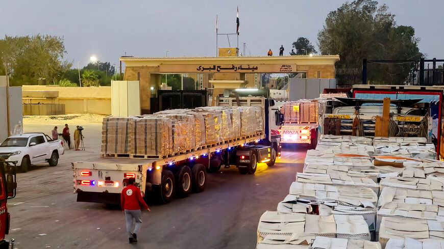 FILE PHOTO: Trucks carrying humanitarian aid line up near the Rafah border crossing between Egypt and the Gaza Strip, amid the ongoing conflict between Israel and Hamas, in Rafah, Egypt, August 13, 2025. REUTERS/Stringer/File photo
