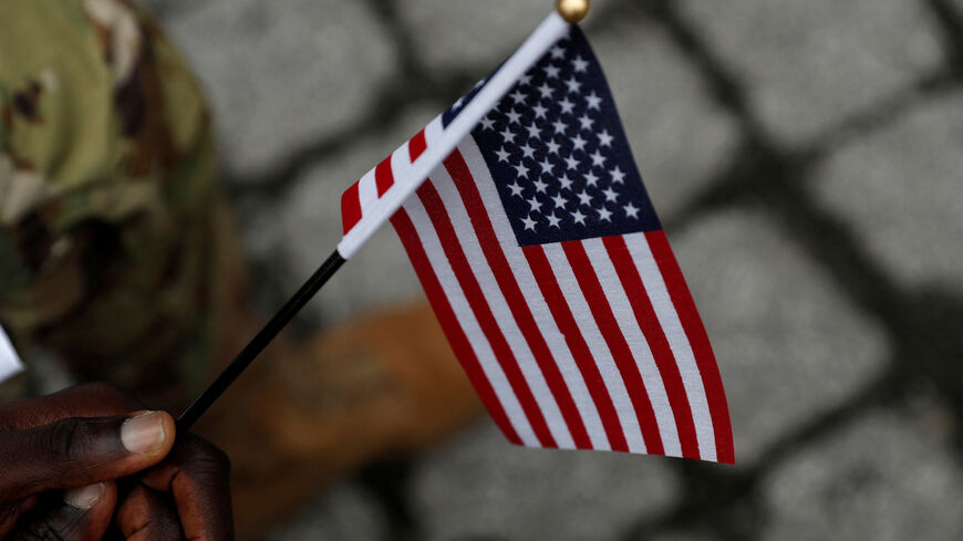 FILE PHOTO: A U.S. Citizenship and Immigration Services (USCIS) naturalization ceremony in New York City, U.S., September 17, 2021. REUTERS/Shannon Stapleton/File Photo