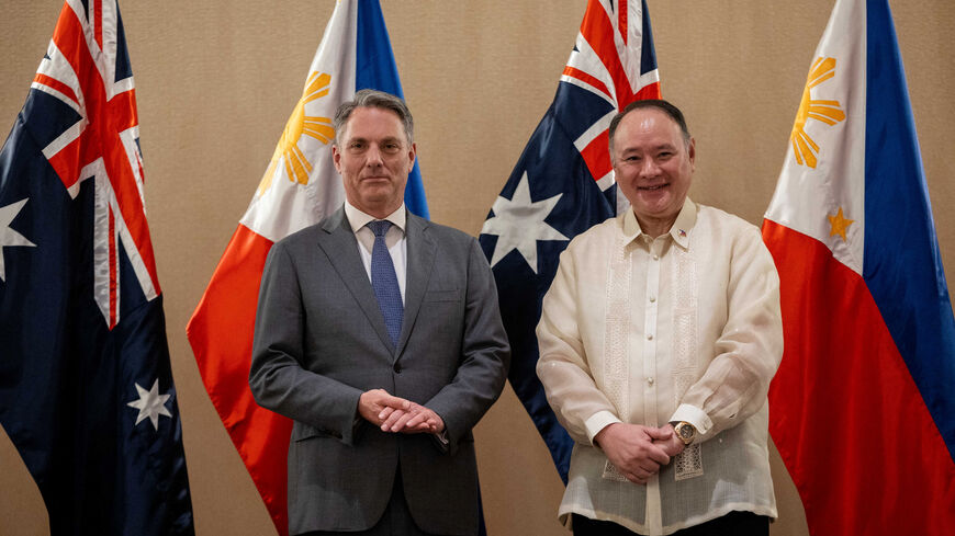 Philippine Defence Minister Gilberto Teodoro and his Australian counterpart Richard Marles pose for a photo after their joint press briefing, in Makati City, Metro Manila, Philippines, August 22, 2025. REUTERS/Eloisa Lopez