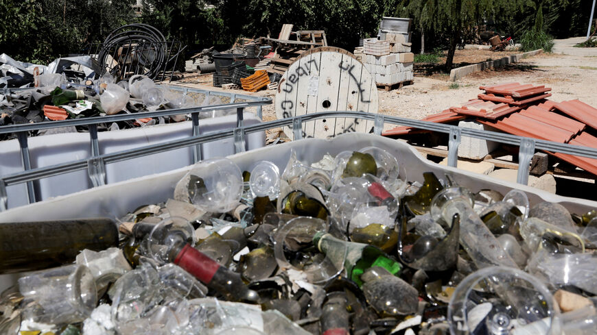 Wine bottles and glass that were damaged during last year's Israeli air strikes, at Rayak winery in Riyak, Bekaa valley, Lebanon, August 21, 2025. REUTERS/Emilie Madi