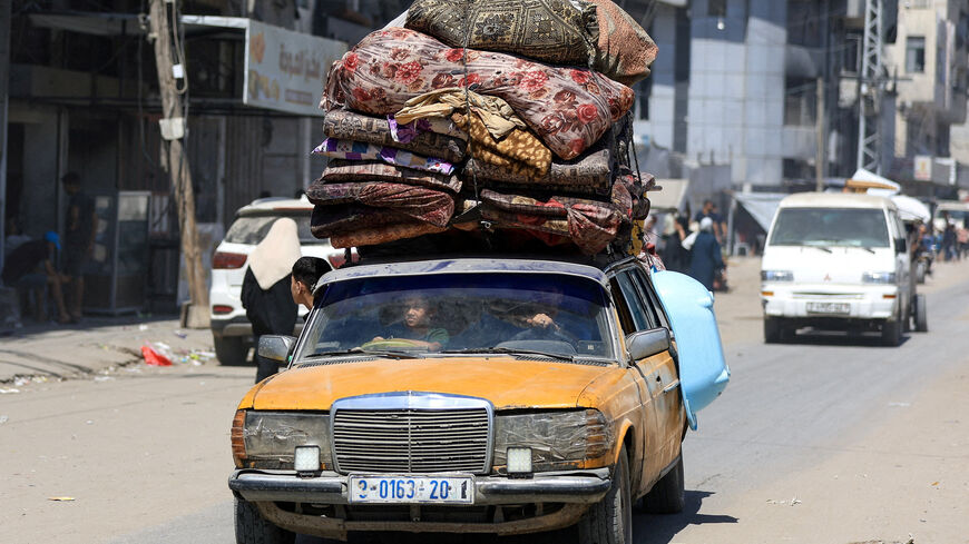 FILE PHOTO: Displaced Palestinians ride in a vehicle loaded with belongings as they flee from one area to another within Gaza City, amid an Israeli military operation, in Gaza City, August 29, 2025. REUTERS/Dawoud Abu Alkas/File Photo