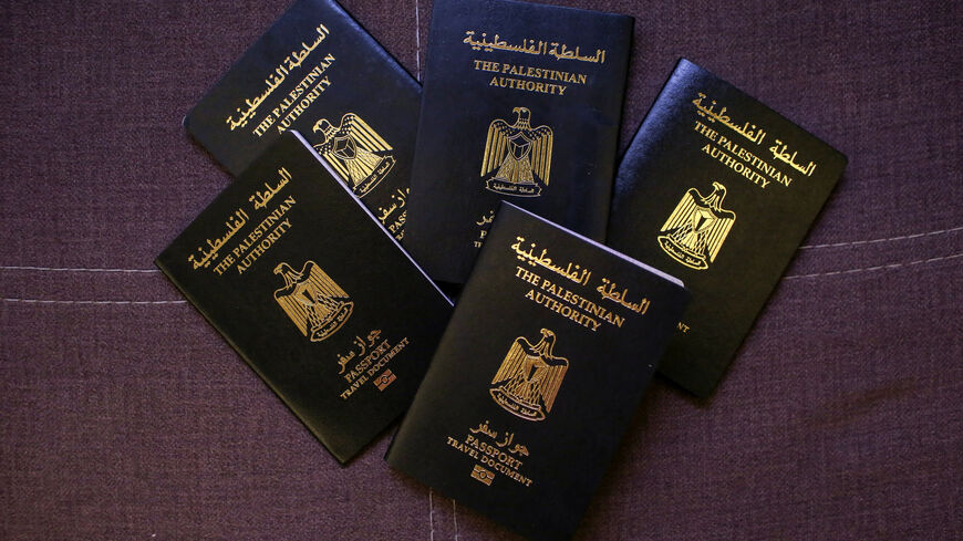 FILE PHOTO: Palestinian passports belonging to members of the Banat Gaza, which means "Girls of Gaza", after fleeing the war in Khan Younis, Gaza, following the events of October 7, 2023, are displayed in Obour City, Egypt July 15, 2025. REUTERS/Hadeer Mahmoud/File Photo