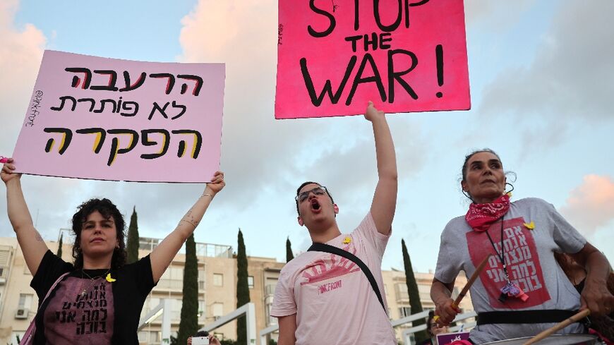 Demonstrators call for an end to the war in Gaza during an anti-government protest in Tel Aviv