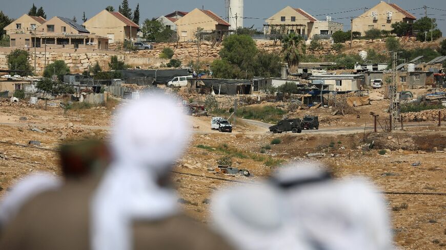 Palestinians say Israel tried to prevent mourners from reaching activist Awdah Hathaleen's funeral