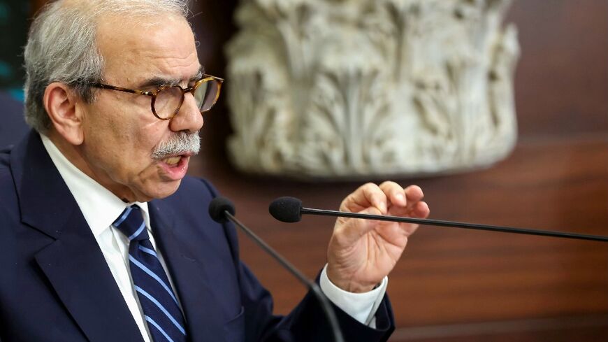 A handout photo released by the Lebanese presidency shows Prime Minister Nawaf Salam speaking to the press after the cabinet session on disarming Hezbollah