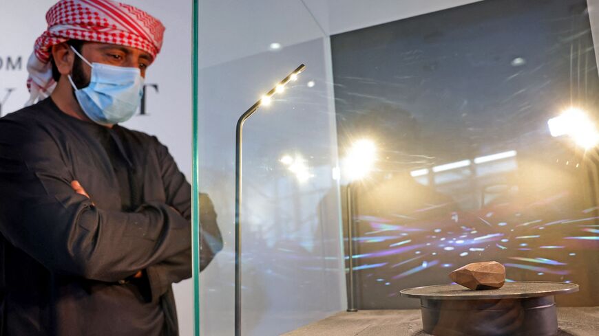 A picture taken on Jan. 17, 2022, shows "The Enigma," a 555.55-carat black diamond, at Sotheby's in the Gulf emirate of Dubai. 