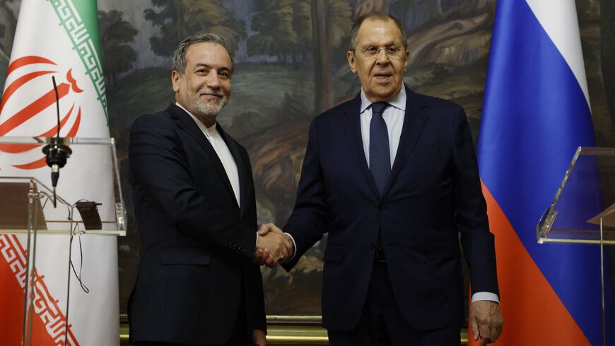 Russia's foreign minister, Sergei Lavrov (R), shakes hands with Iran's foreign minister, Abbas Araghchi (L), during a joint press conference following their talks in Moscow on April 18, 2025.