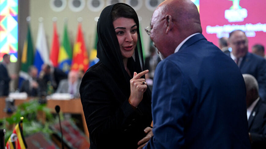 UAE's Minister of State for International Cooperation Reem Al Hashimy (L) and Uganda's Foreign Affairs Minister Odongo Jeje Abubakhar at the BRICS Foreign Ministers meeting in Rio de Janeiro, Brazil, on April 29, 2025. (MAURO PIMENTEL/AFP via Getty Images)