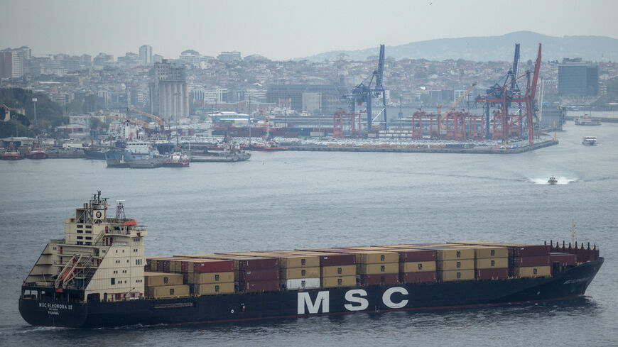 A container ship passes in front of Haydarpasa Port as it navigates the Bosphorus Strait on May 2, 2025 in Istanbul, Turkey.