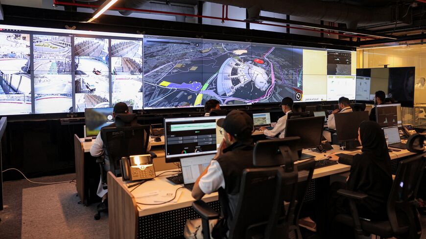 Employees man their terminals at the control room for traffic and crowd management for pilgrims at the General Transport Centre at the Royal Commission for Mecca and Holy Sites in Mecca on June 3, 2025. 