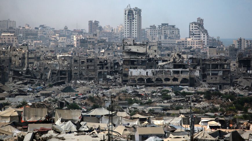 Tents used as temporary shelters by displaced Palestinians are set up near war-damaged buildings in Gaza City on Aug. 8, 2025.
