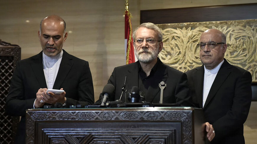 Iran's Supreme National Security Council chief Ali Larijani (C) speaks to reporters after meeting with Lebanon's parliament speaker in Beirut on Aug. 13, 2025. 