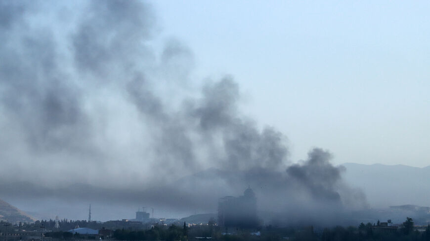 Smoke billows over a neighborhood of Sulaimaniyah, east of the autonomous Kurdistan region of Iraq, after security forces arrested opposition figure Lahur Sheikh Jangi, following several hours of armed clashes on Aug. 22, 2025.
