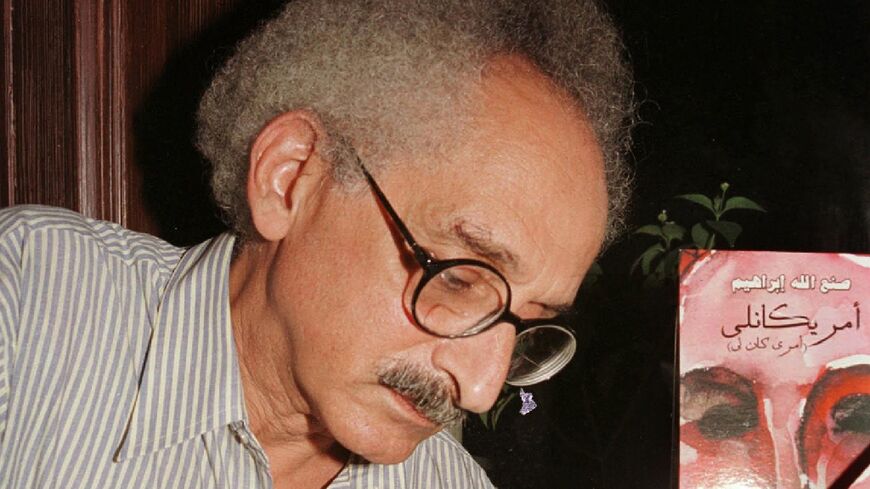 Renowned Egyptian novelist Sonallah Ibrahim, who died on Wednesday at the age of 88, is seen here at a Cairo book signing in September 2003.