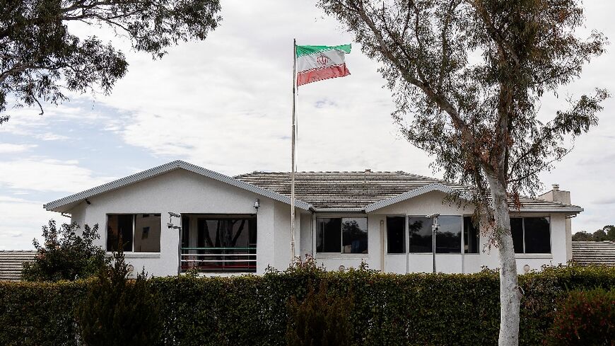 The Iranian national flag flies over the Iranian embassy building in Canberra on August 26, 2025