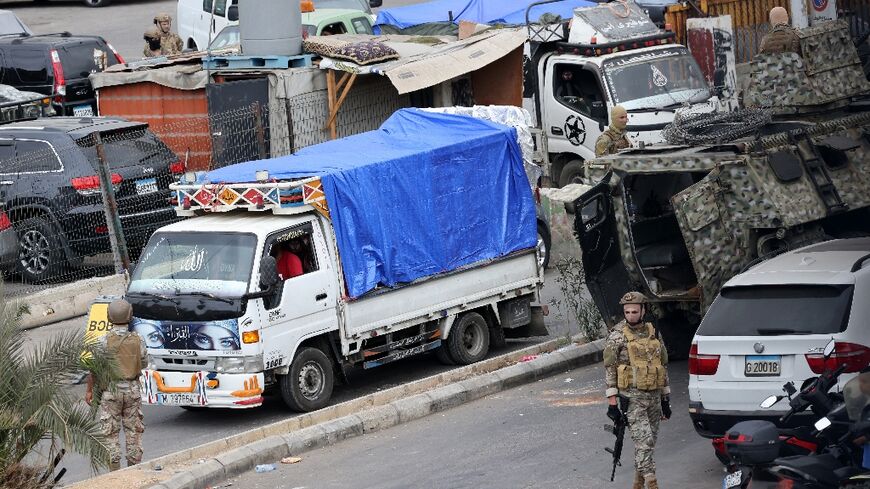 Trucks loaded with Palestinian weapons pull out of the Burj al-Barajneh camp in the Lebanese capital, completing the disarmament of Palestine Liberation Organisation factions in Beirut refugee camps.