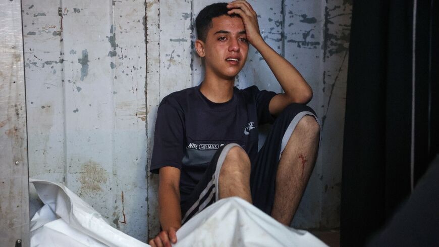 Palestinians mourned over their loved ones at Gaza City's Al-Shifa Hospital following overnight strikes