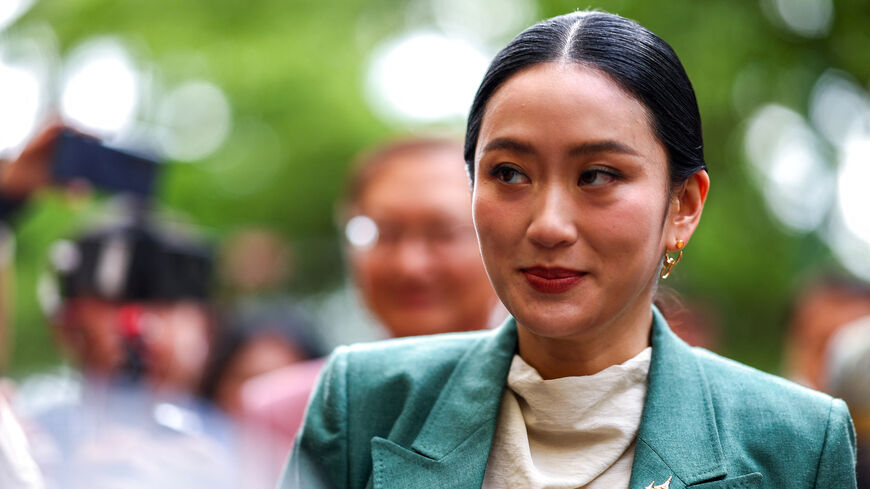 FILE PHOTO: Thailand’s Prime Minister Paetongtarn Shinawatra reacts as she arrives ahead of a cabinet meeting at the Government House, in Bangkok, Thailand, July 1, 2025. REUTERS/Athit Perawongmetha/ File Photo