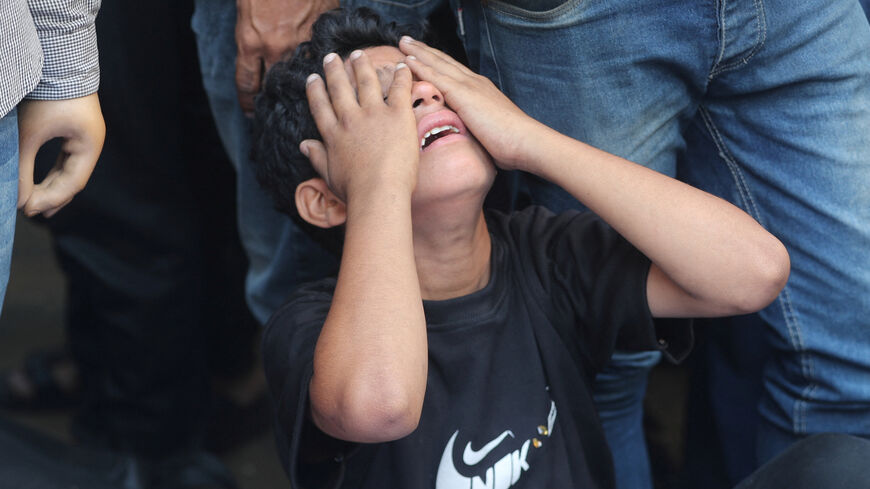 A boy mourns during the funeral of Palestinians killed in overnight Israeli strikes, according to medics, at Al-Shifa Hospital in Gaza City, September 1, 2025. REUTERS/Mahmoud Issa