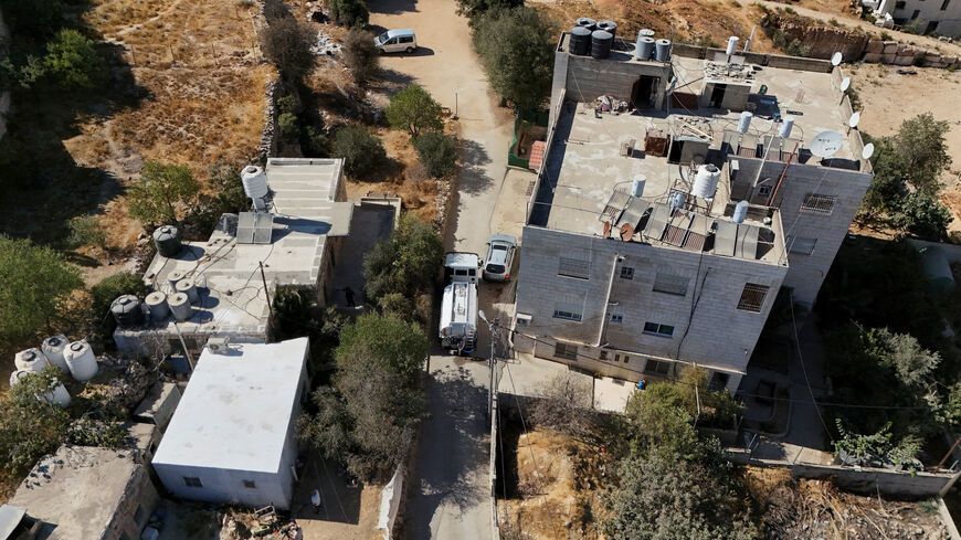 A drone view shows a water tanker delivering water to houses in Hebron in the Israeli-occupied West Bank, August 23, 2025. REUTERS/Yosri Aljamal