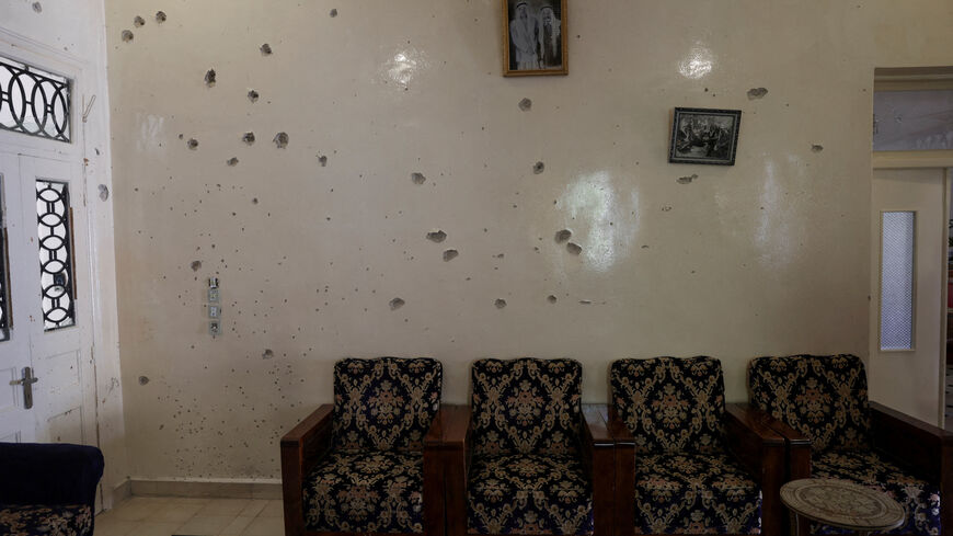 FILE PHOTO: A wall is pockmarked by bullet holes inside the Saraya family house, following sectarian violence in Syria's Sweida province, where government forces were sent to quell local clashes between Druze armed factions and Bedouin tribal fighters, in the predominantly Druze city of Sweida, Syria, July 25, 2025. REUTERS/Khalil Ashawi/File Photo
