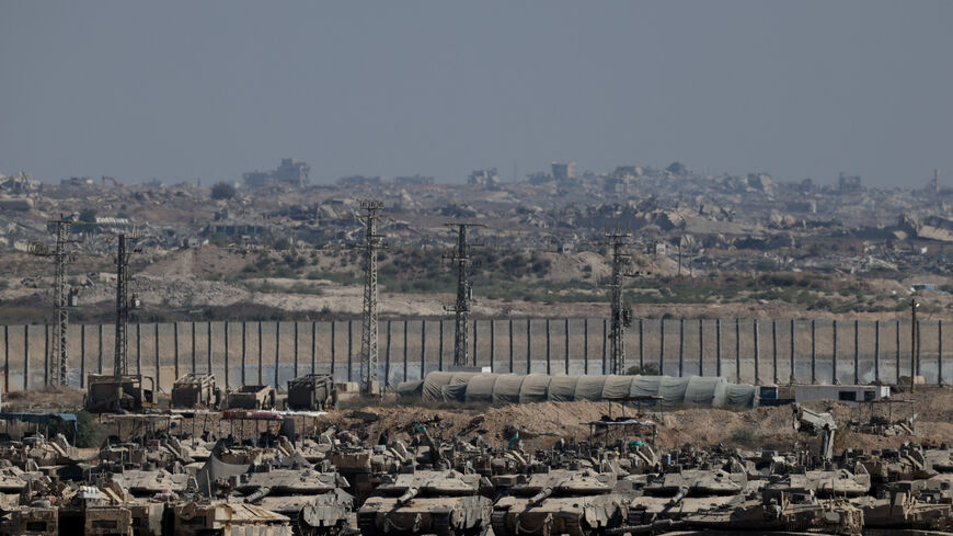 FILE PHOTO: Military vehicles stand on the Israeli side of the border with Gaza, in Israel September 5, 2025. REUTERS/Shir Torem/File Photo