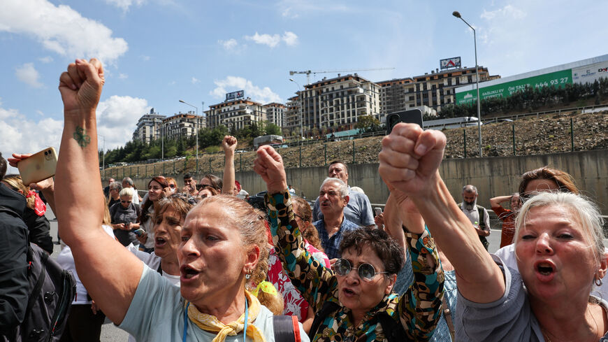 People protest as police officers block the road leading to the Istanbul provincial office of Turkey's main opposition Republican People's Party (CHP), as supporters of CHP try to reach the office, after a recent court ruling that ousted the CHP's Istanbul provincial leadership, in Istanbul, Turkey, September 8, 2025. REUTERS/Umit Bektas