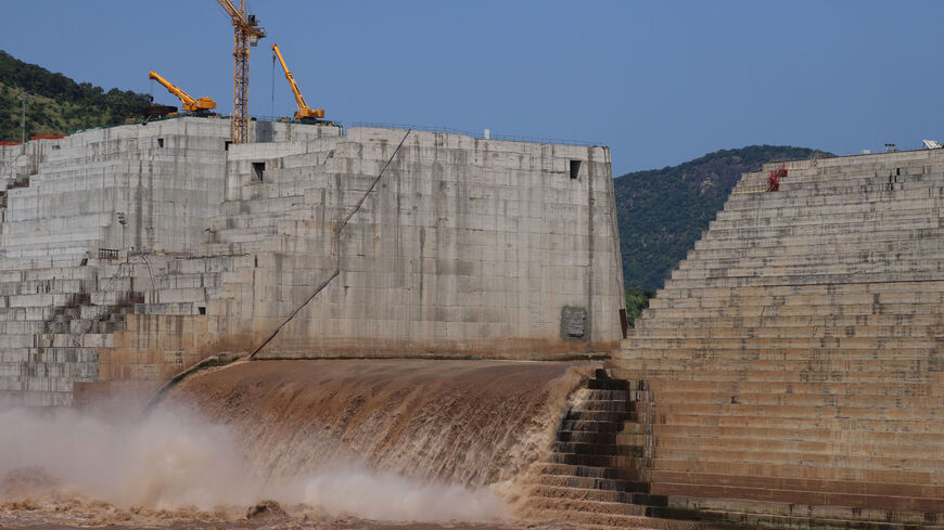 FILE PHOTO: Water flows through Ethiopia's Grand Renaissance Dam as it undergoes construction work on the river Nile in Guba Woreda, Benishangul Gumuz Region, Ethiopia September 26, 2019. Picture taken September 26, 2019. REUTERS/Tiksa Negeri/File Photo
