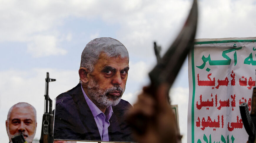 FILE PHOTO: A person holds a cut-out depicting late Hamas leader Yahya Sinwar as protesters, predominantly Houthi supporters, demonstrate to show solidarity with the Palestinians in the Gaza Strip and to condemn the U.S. strikes in Yemen, in Sanaa, Yemen April 11, 2025. REUTERS/Khaled Abdullah/File Photo
