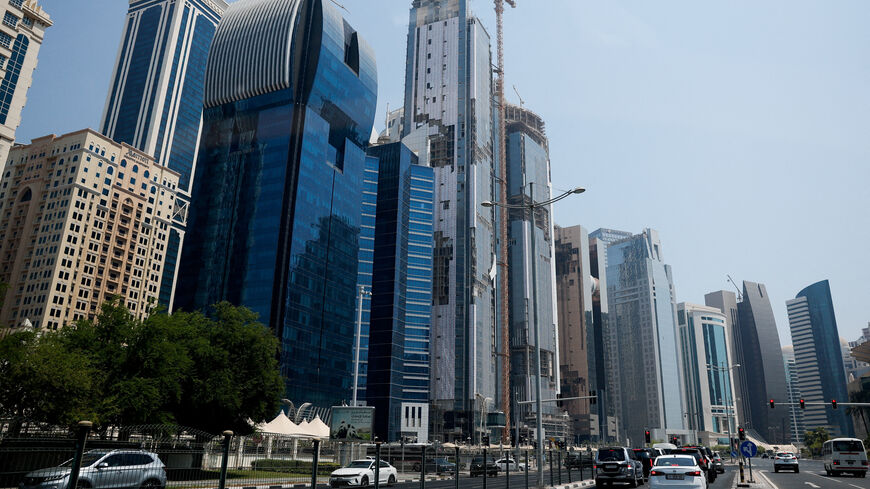 FILE PHOTO: Vehicles stop at a red traffic light, a day after an Israeli attack on Hamas leaders, in Doha, Qatar, September 10, 2025. REUTERS/Ibraheem Abu Mustafa/File Photo