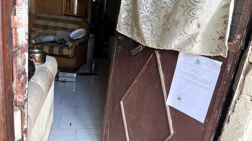 An eviction notice is posted on the door of a house, as Syrian authorities carry out eviction orders in the predominantly Alawite neighbourhood of al-Somaria, in Damascus, Syria, August 29, 2025. REUTERS/Feras Dalatey