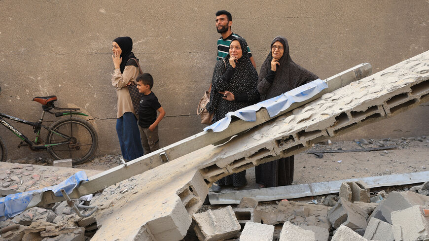 Palestinians inspect the damage at the site of Israeli strikes that destroyed Al-Jundi al-Majhoul residential tower on Sunday, in Gaza City, September 15, 2025. REUTERS/Dawoud Abu Alkas