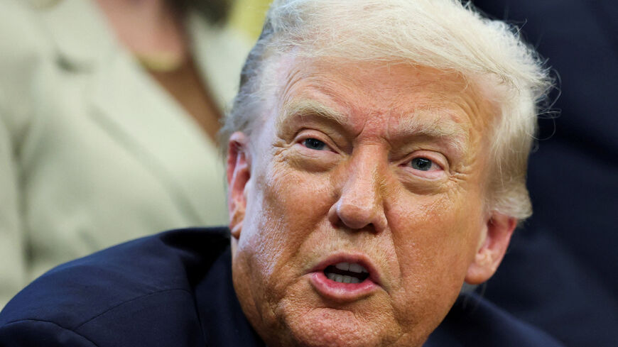 U.S. President Donald Trump reacts after signing a memorandum to send federal resources to Memphis, Tennessee, for a surge against local crime, in the Oval Office at the White House in Washington, D.C., U.S., September 15, 2025. REUTERS/Jonathan Ernst