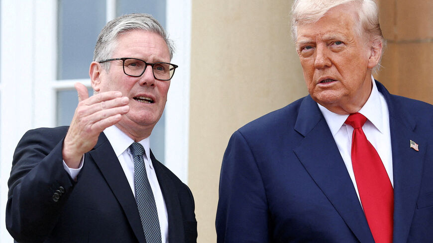 FILE PHOTO: U.S. President Donald Trump meets with British Prime Minister Keir Starmer at Trump Turnberry golf course in Turnberry, Scotland, Britain, July 28, 2025. REUTERS/Evelyn Hockstein/File Photo