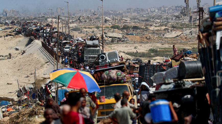 Displaced Palestinians, fleeing northern Gaza due to an Israeli military operation, move southward after Israeli forces ordered residents of Gaza City to evacuate to the south, in the central Gaza Strip September 16, 2025. REUTERS/Mahmoud Issa/File Photo