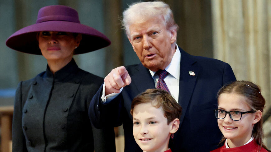 U.S. President Donald Trump points a finger as he and first lady Melania Trump visit St. George's Chapel during their state visit in Windsor, Britain, September 17, 2025. REUTERS/Kevin Lamarque