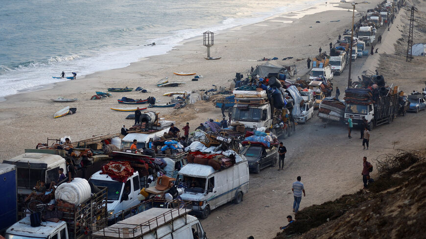 Displaced Palestinians, fleeing northern Gaza due to an Israeli military operation, move southward after Israeli forces ordered residents of Gaza City to evacuate to the south, in the central Gaza Strip, September 19, 2025. REUTERS/Mahmoud Issa