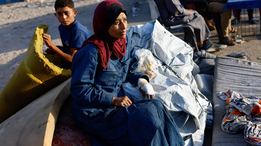 Displaced Palestinians, fleeing northern Gaza due to an Israeli military operation, rest after evacuating southwards following Israeli forces' orders to leave Gaza City, in the central Gaza Strip, September 23, 2025. REUTERS/Mahmoud Issa
