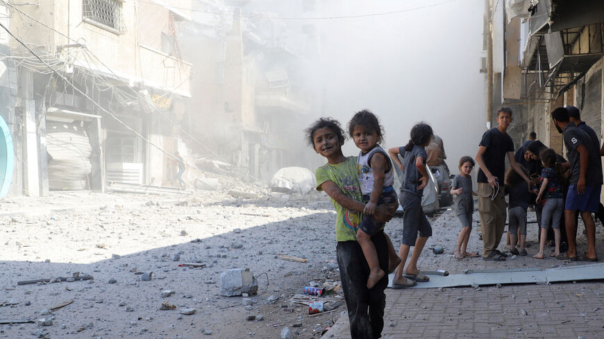 Palestinians children react, at the site of Israeli strikes on a house, in Gaza City, September 26, 2025. REUTERS/Ebrahim Hajjaj