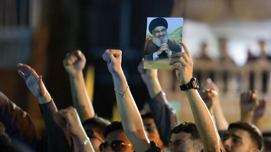 Hezbollah supporters gesture as they gather at the site where the group's late leader Hassan Nasrallah was killed, before the first anniversary of his assassination in an airstrike, in Beirut's southern suburbs, Lebanon, September 26, 2025. REUTERS/Mohamed Azakir