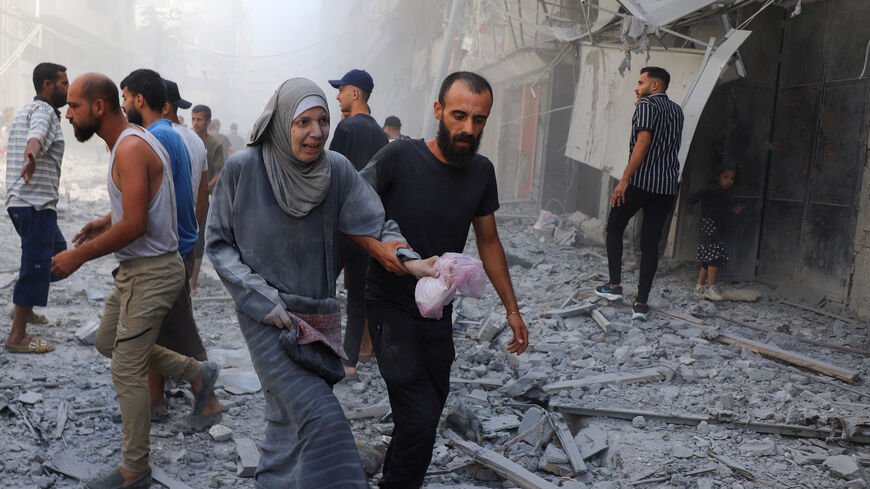 Palestinians inspect the site of Israeli strikes on a house, in Gaza City, September 26, 2025. REUTERS/Ebrahim Hajjaj